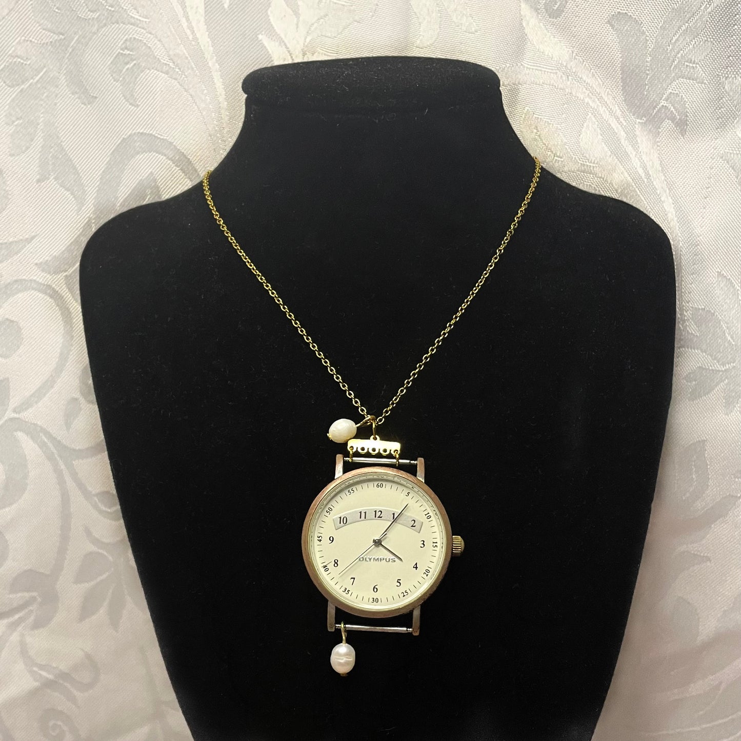 ernie watch necklace