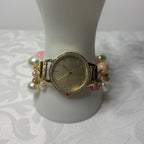 pink lady working beaded watch bracelet